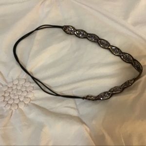 It is a headband it is silver and brown